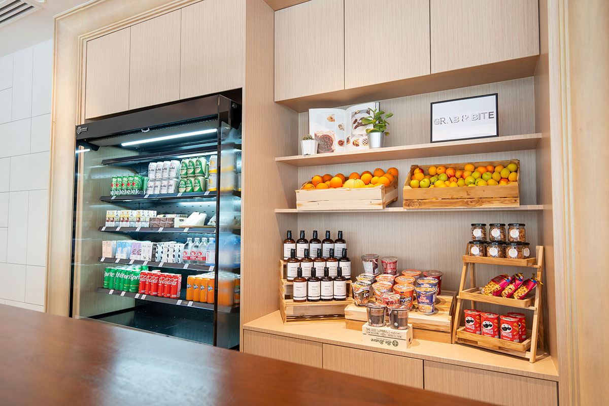 24 hour Grab & Bite grocery at Novotel Living Bangkok Sukhumvit Legacy, offering food and drinks for guests.