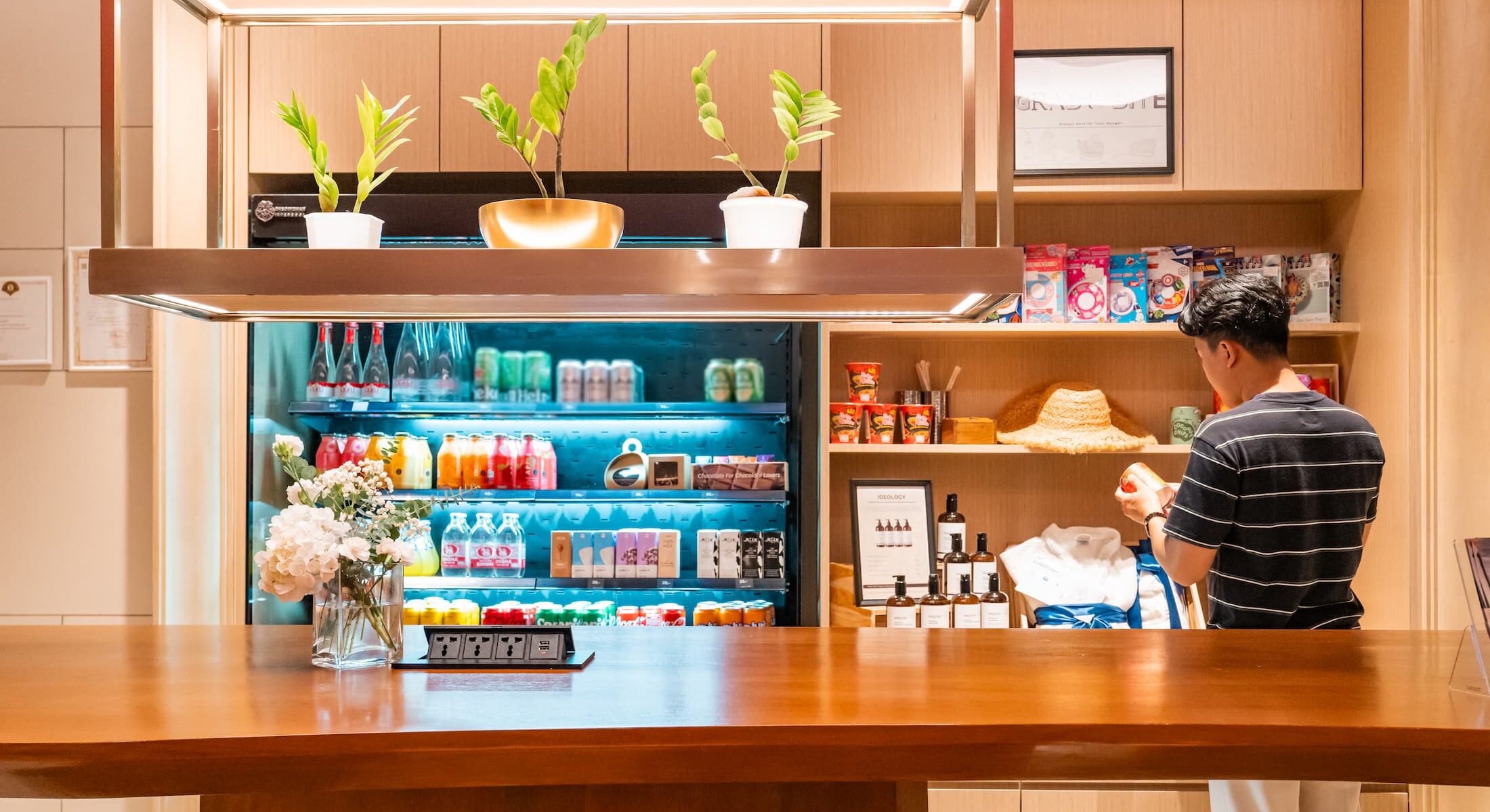 24 hour Grab & Bite grocery at Novotel Living Bangkok Sukhumvit Legacy, offering food and drinks for guests.