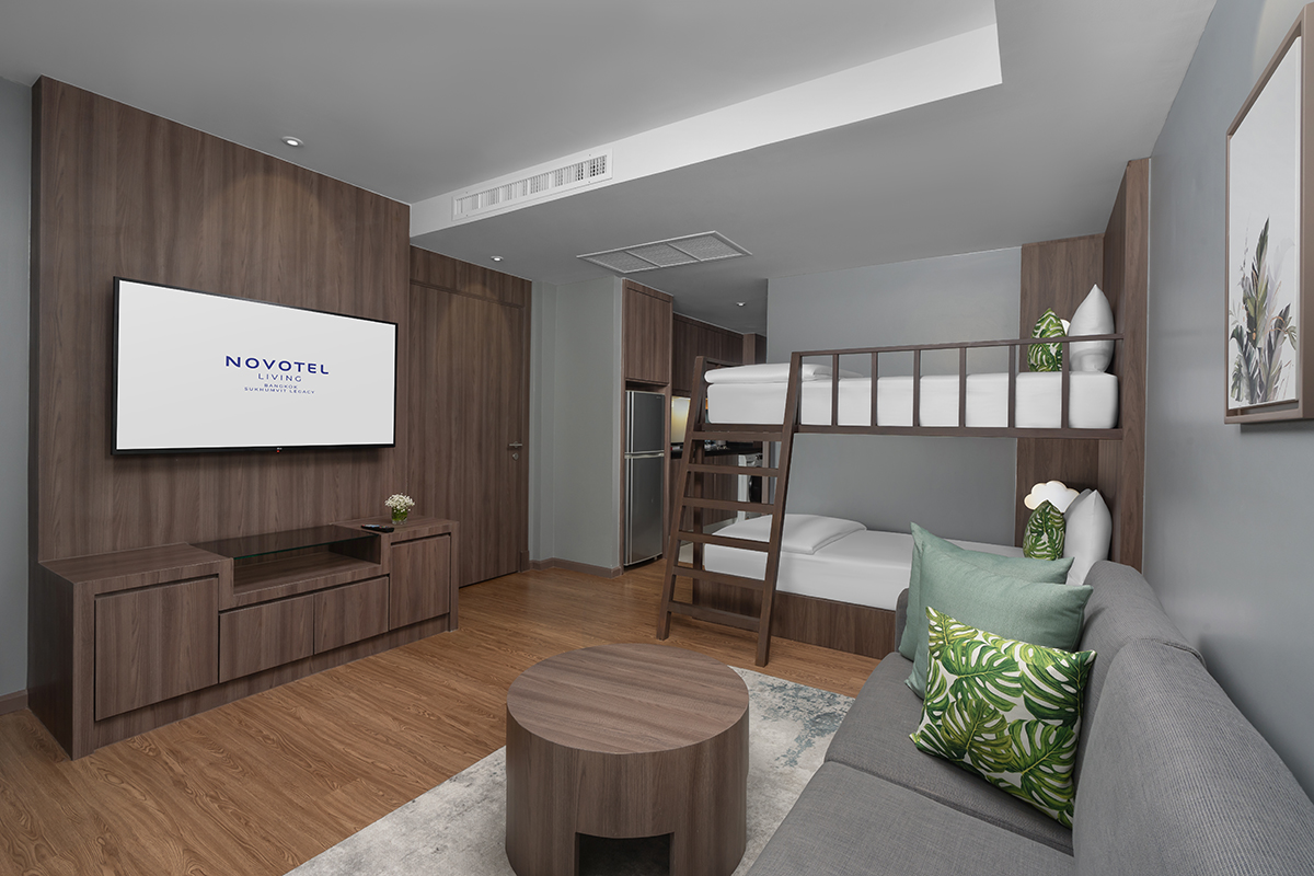 Modern family hotel suite with bunk bed and cozy amenities for kids
