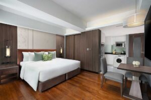 Spacious Studio Executive Room with kitchen, laundry, and modern amenities at Novotel Living Bangkok Sukhumvit Legacy