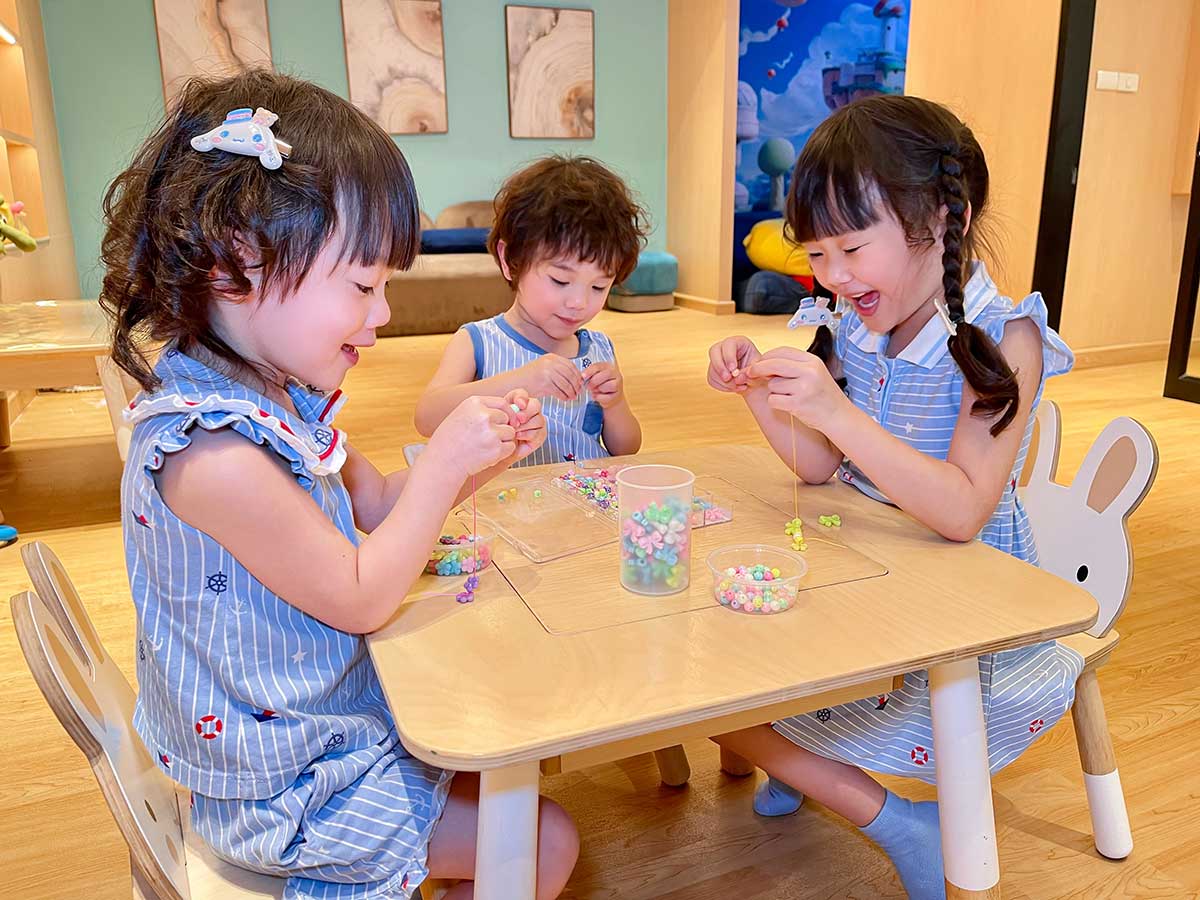 Children enjoy fun activities at the hotel's Kids Club with a ball pit, games, and reading corner.