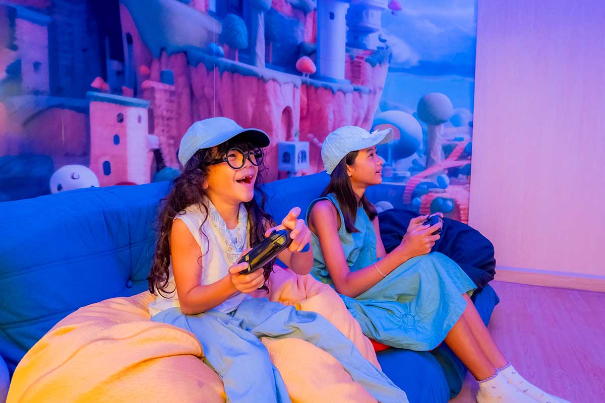 Children enjoy fun activities at the hotel's Kids Club with a ball pit, games, and reading corner.